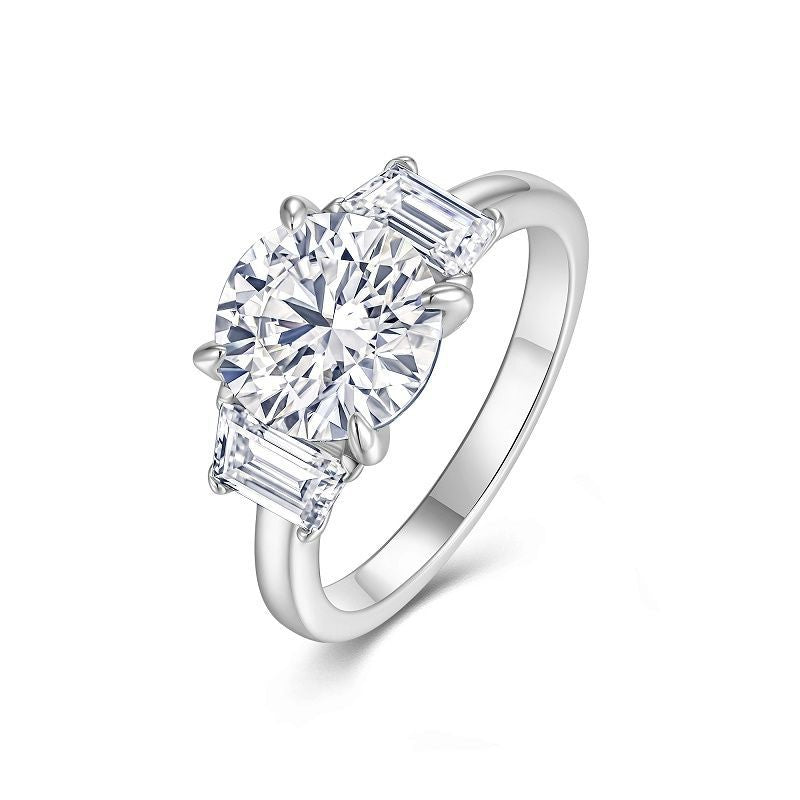 Silver three-stone zirconia ring on a white background