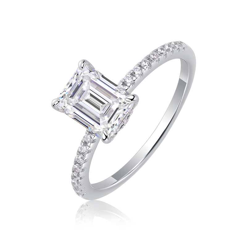 Silver emerald-cut zirconia halo ring on a white background
