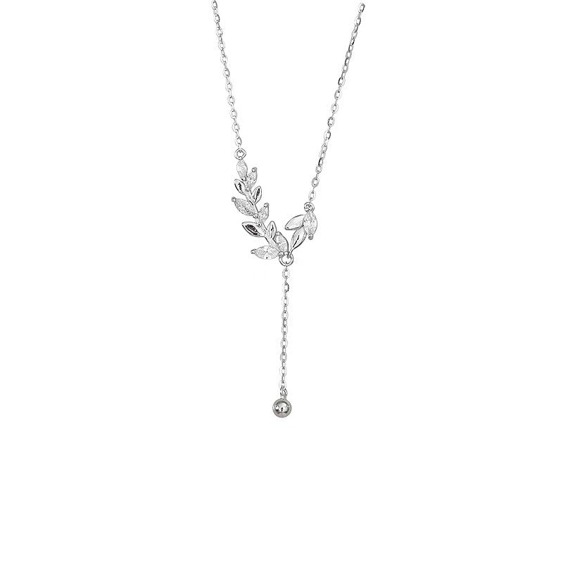 Silver leaf pendant necklace on a white background