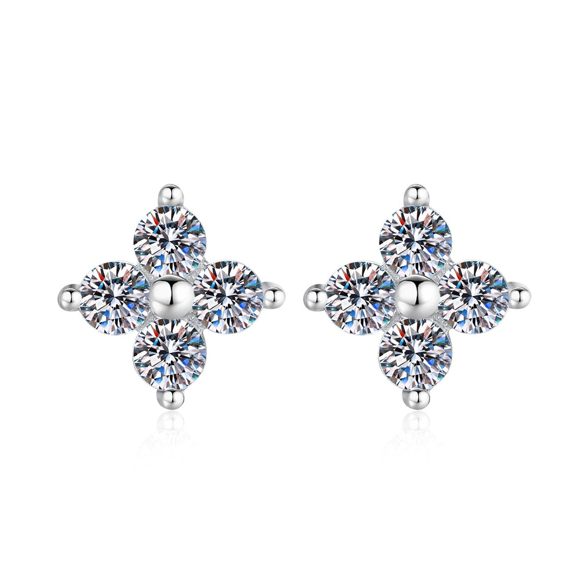 Silver four-stone moissanite stud earrings on a white background