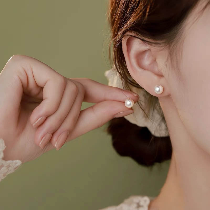 999 silver colored imitation pearl earrings