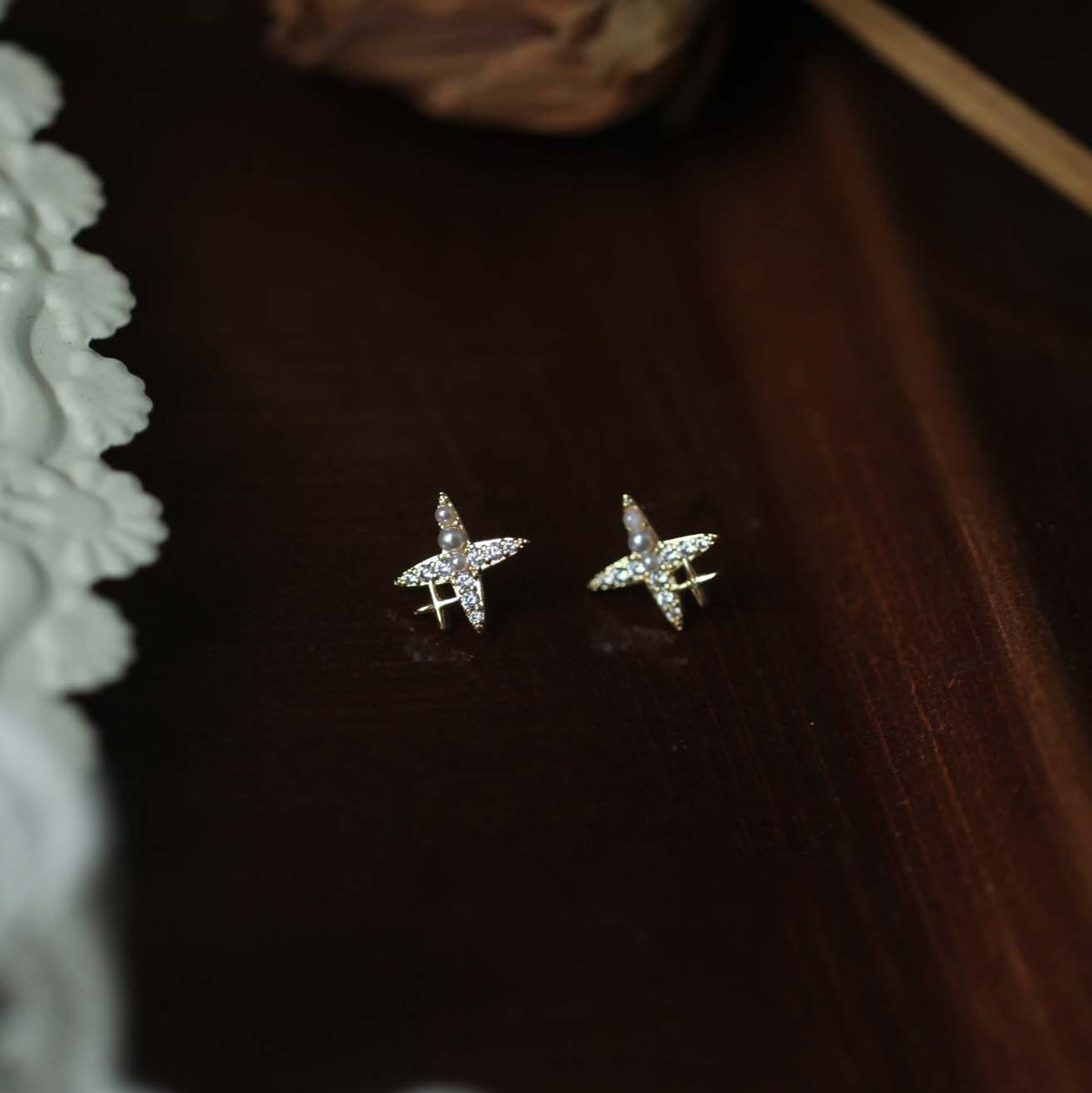 925 sterling silver four pointed star earrings - golden