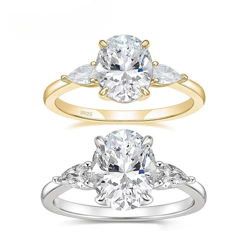 Oval CZ Three-Stone Ring With Pear Accents