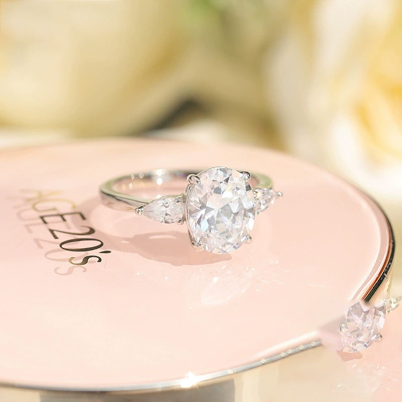 Oval CZ Three-Stone Ring With Pear Accents – image 4